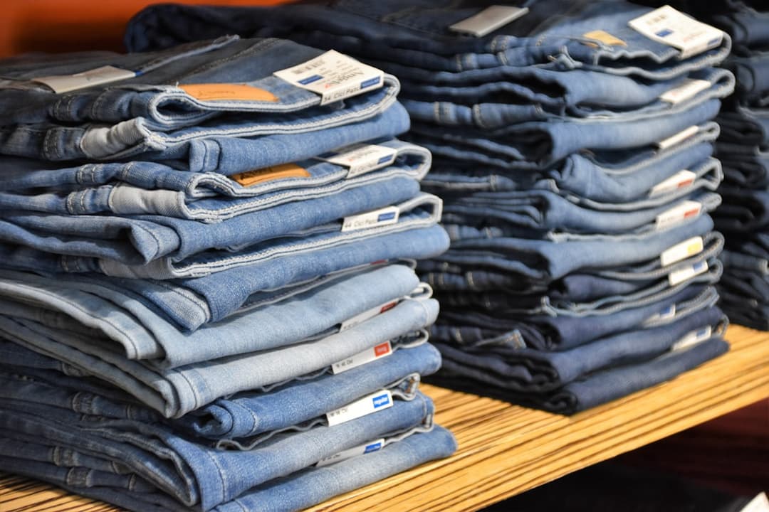 Folded secondhand denim with original tags still on