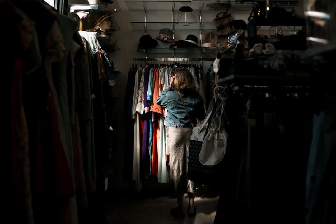 Browsing a rack of secondhand clothing